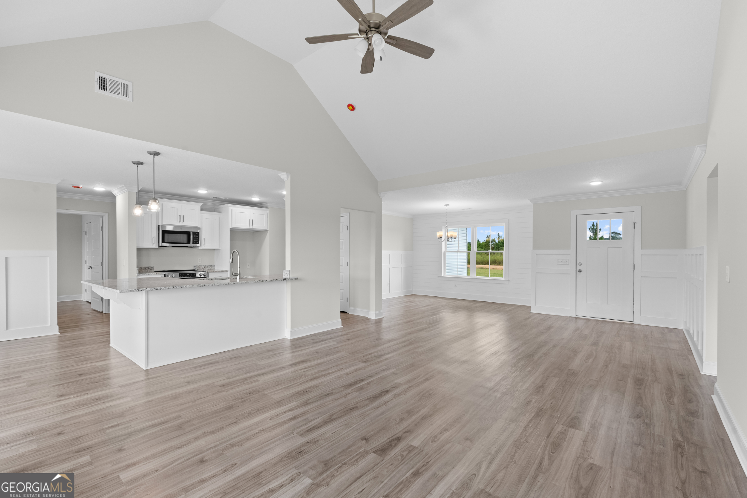 543 Jack Kennedy Road Statesboro, GA 30458 - Photo 5 of 35 a view of kitchen with cabinets and wooden floor