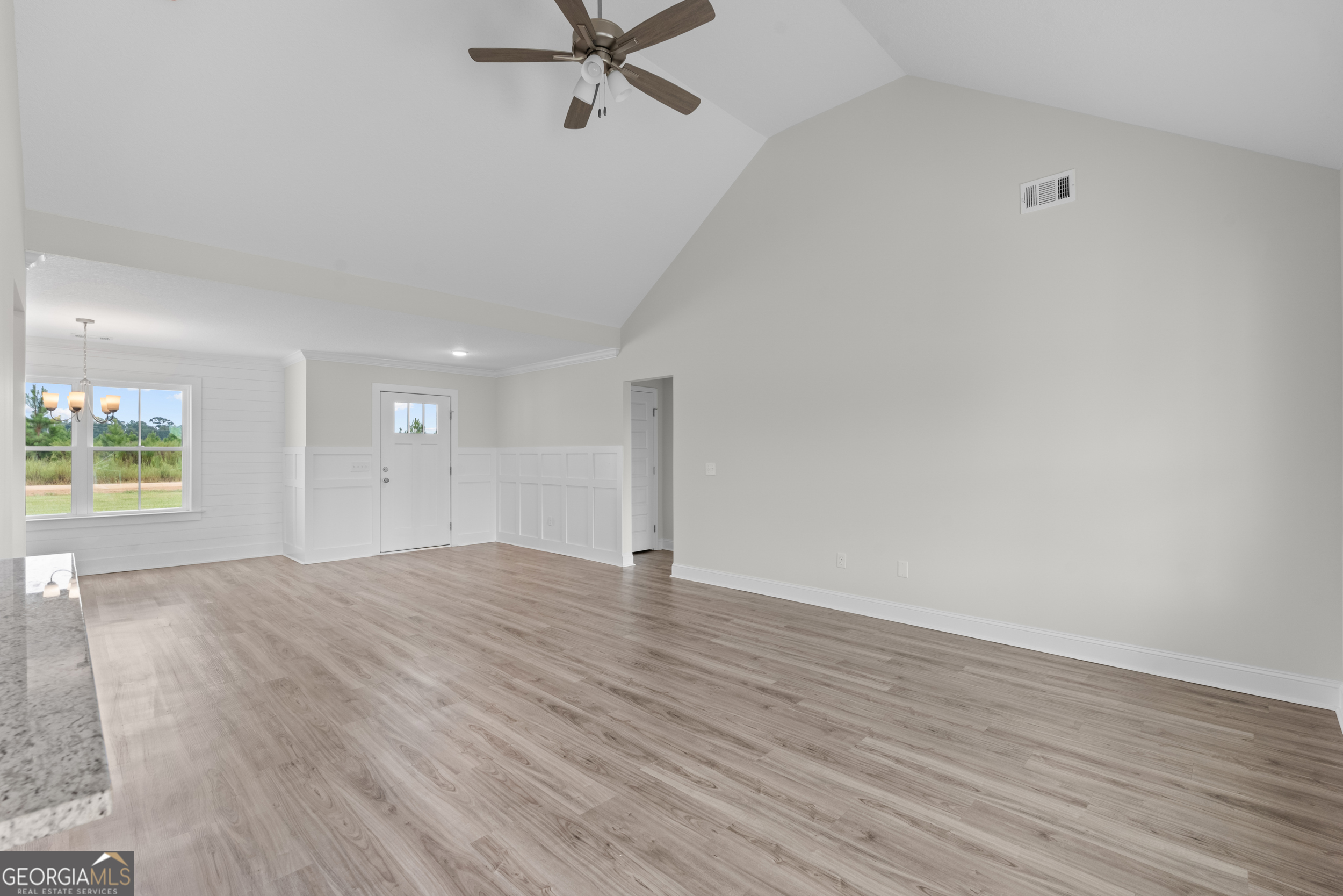 543 Jack Kennedy Road Statesboro, GA 30458 - Photo 6 of 35 wooden floor in an empty room with a window
