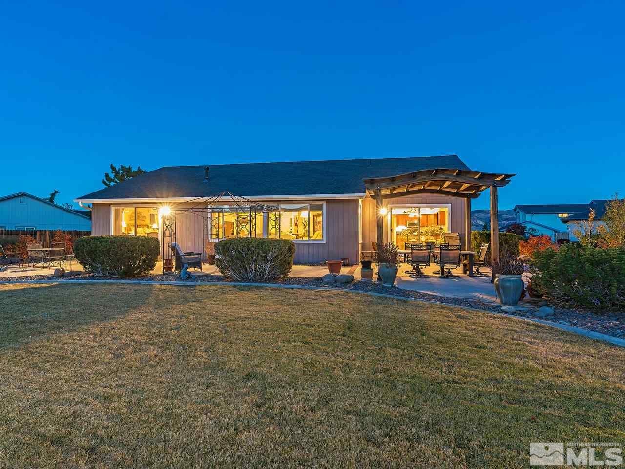 15523 Quicksilver Drive Reno, NV 89511 - Photo 25 of 25 a view of a house with a yard and a garage