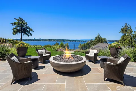 a view of a patio with couple of chairs