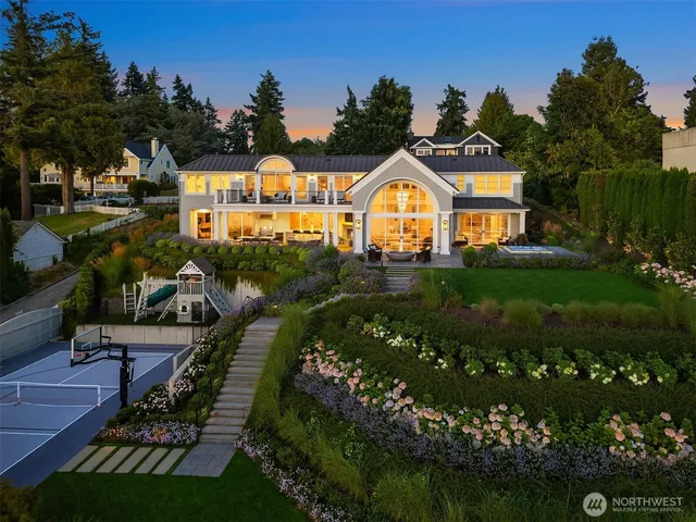 a view of swimming pool with garden and patio