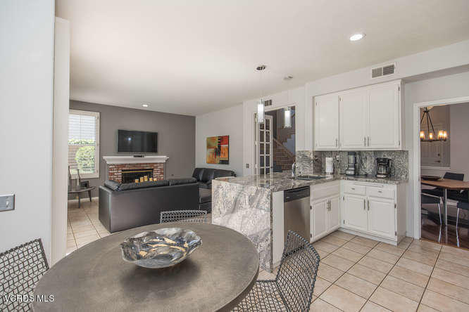 11218 Shadyridge Road Moorpark, CA 93021 - Photo 27 of 48 a kitchen with stainless steel appliances kitchen island granite countertop a sink and cabinets