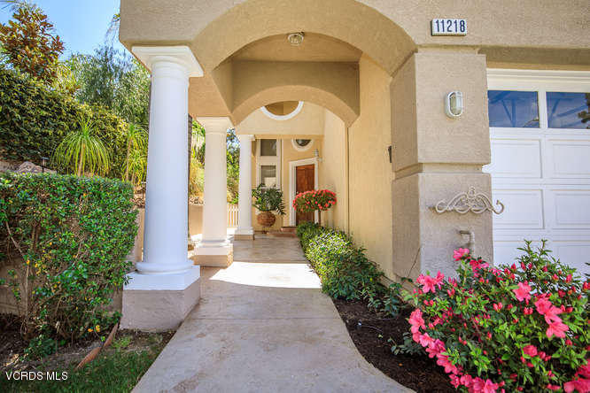 11218 Shadyridge Road Moorpark, CA 93021 - Photo 9 of 48 a front view of a house with a garden