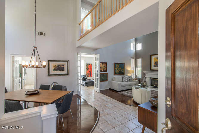 11218 Shadyridge Road Moorpark, CA 93021 - Photo 10 of 48 a living room with fireplace furniture and a view of kitchen