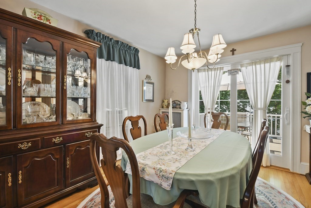 41 Peirce Street Arlington, MA 02476 - Photo 11 of 32 a view of a dining room with furniture wooden floor and chandelier