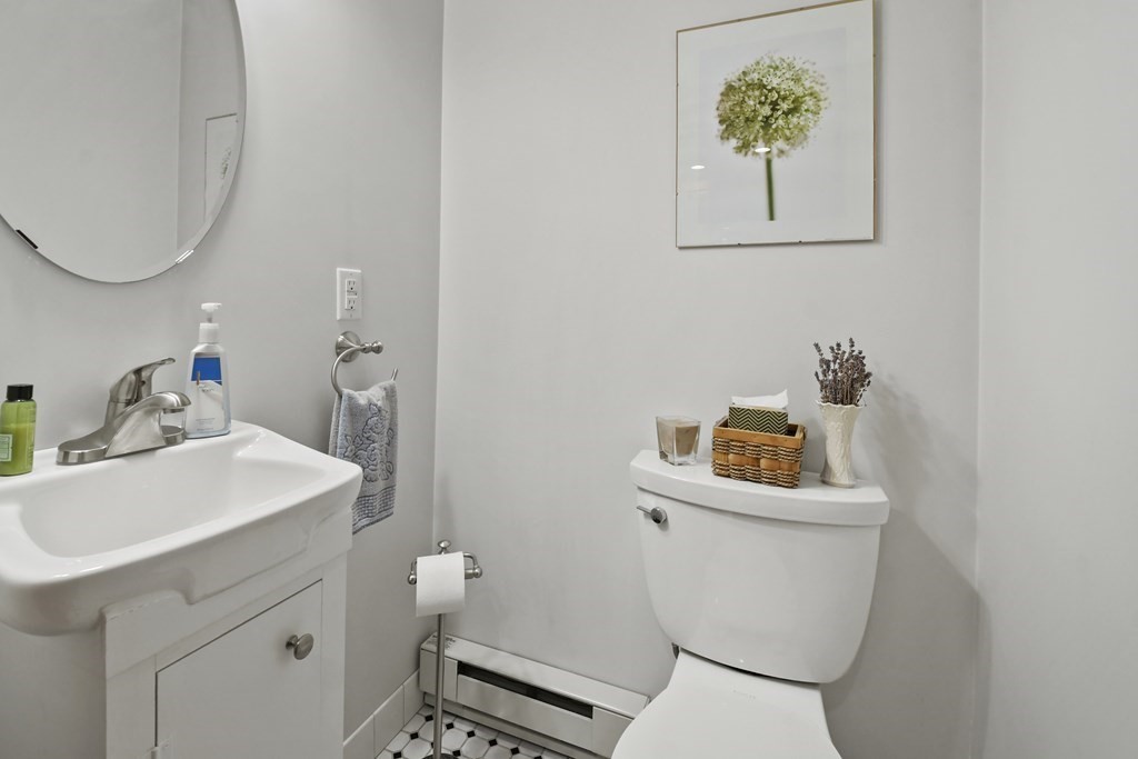 41 Peirce Street Arlington, MA 02476 - Photo 16 of 32 a bathroom with a sink mirror vanity and toilet