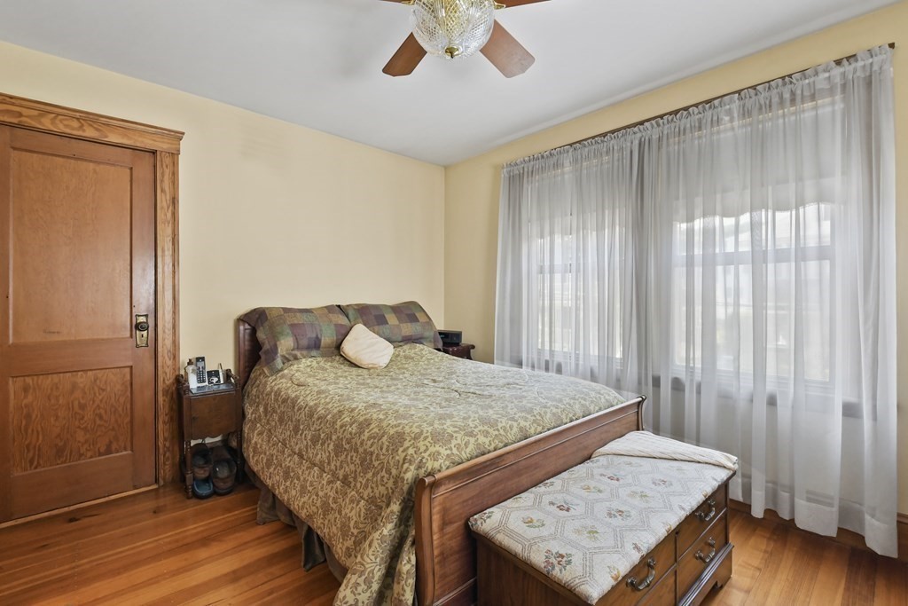 41 Peirce Street Arlington, MA 02476 - Photo 18 of 32 a bed sitting in a spacious bedroom next to a window