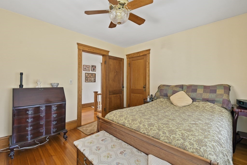 41 Peirce Street Arlington, MA 02476 - Photo 20 of 32 a bedroom with a bed and a dresser
