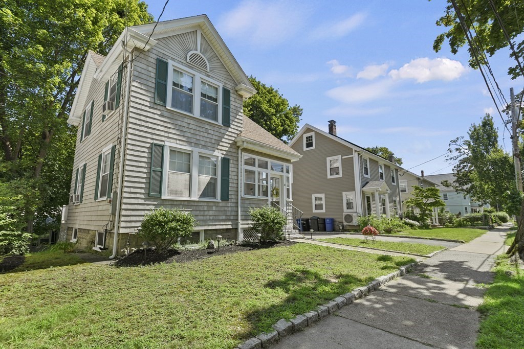 41 Peirce Street Arlington, MA 02476 - Photo 2 of 32 a front view of a house with a yard