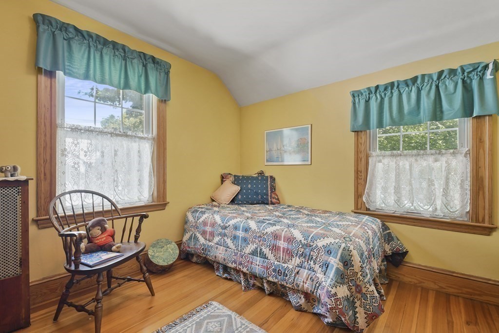 41 Peirce Street Arlington, MA 02476 - Photo 21 of 32 a bedroom with a bed and a window