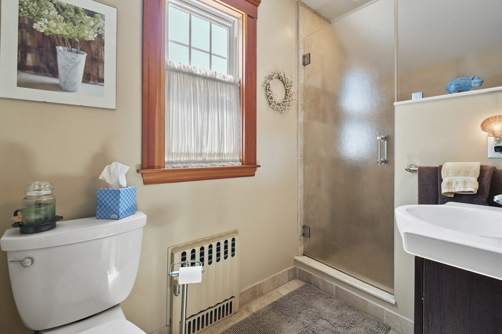 41 Peirce Street Arlington, MA 02476 - Photo 23 of 32 a bathroom with a sink and mirror