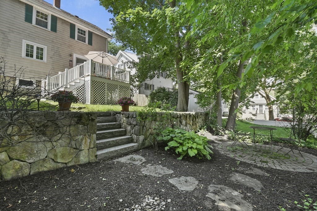 41 Peirce Street Arlington, MA 02476 - Photo 30 of 32 a front view of a house with a garden