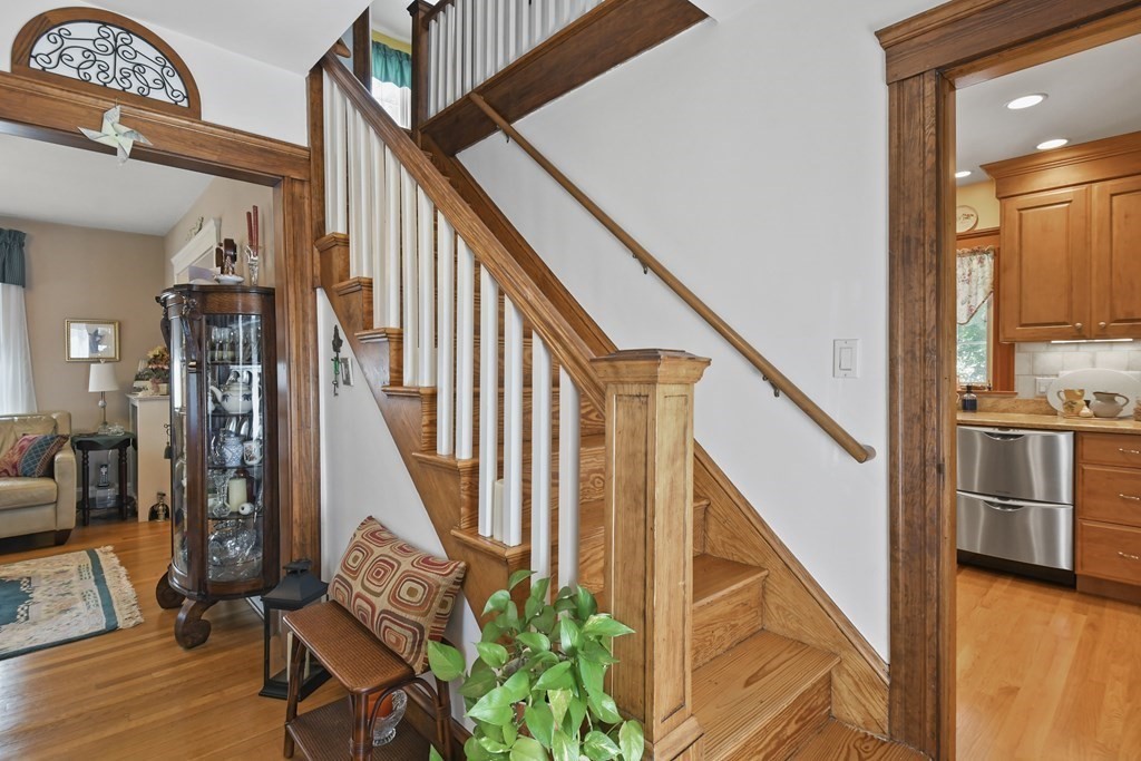 41 Peirce Street Arlington, MA 02476 - Photo 5 of 32 a view of an entryway with wooden floor and a front door