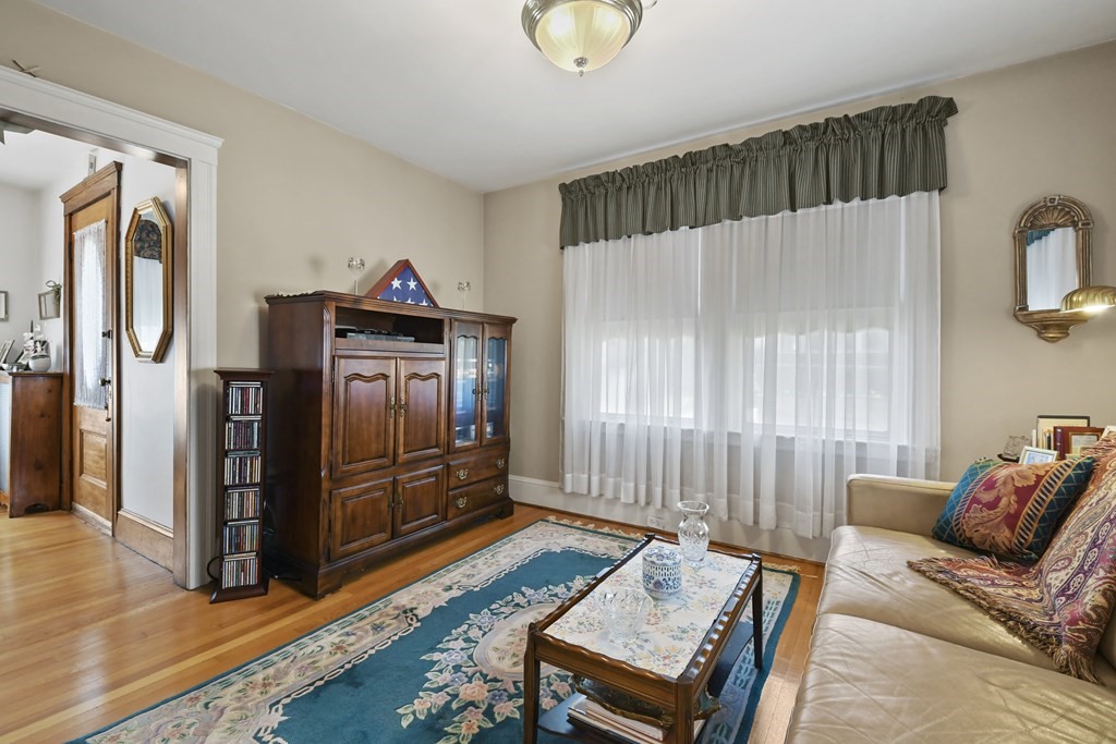 41 Peirce Street Arlington, MA 02476 - Photo 9 of 32 a living room with furniture and a gate