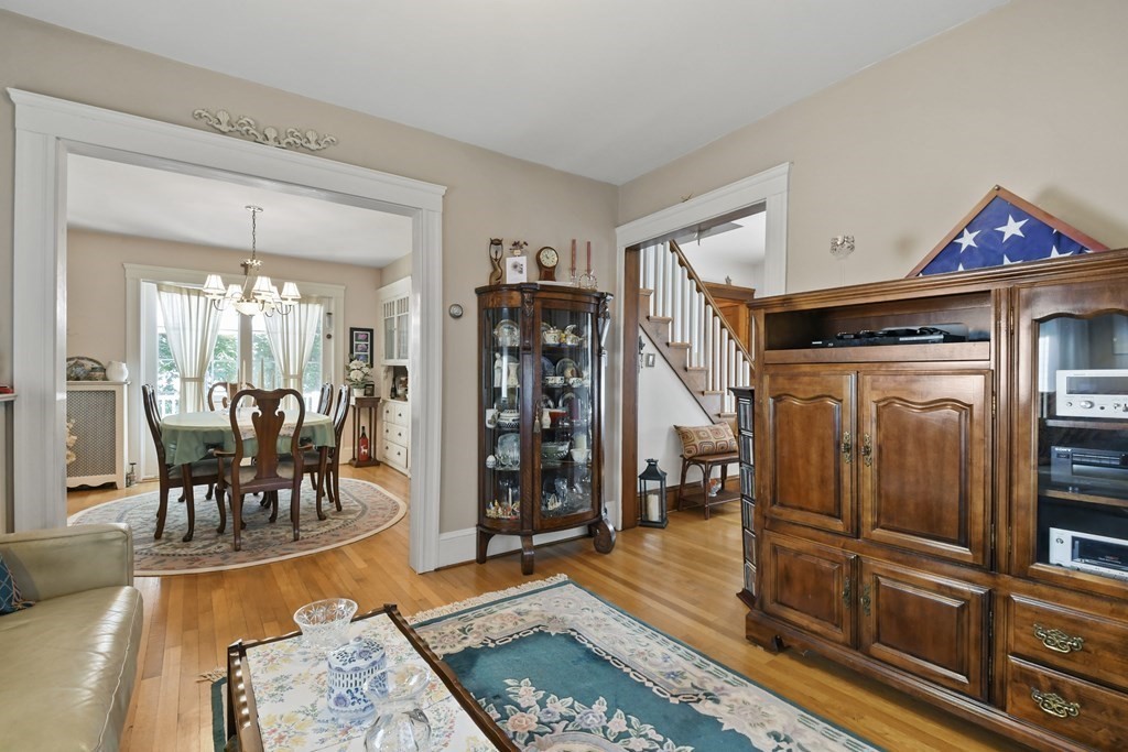 41 Peirce Street Arlington, MA 02476 - Photo 10 of 32 a living room with furniture a rug and a dining table