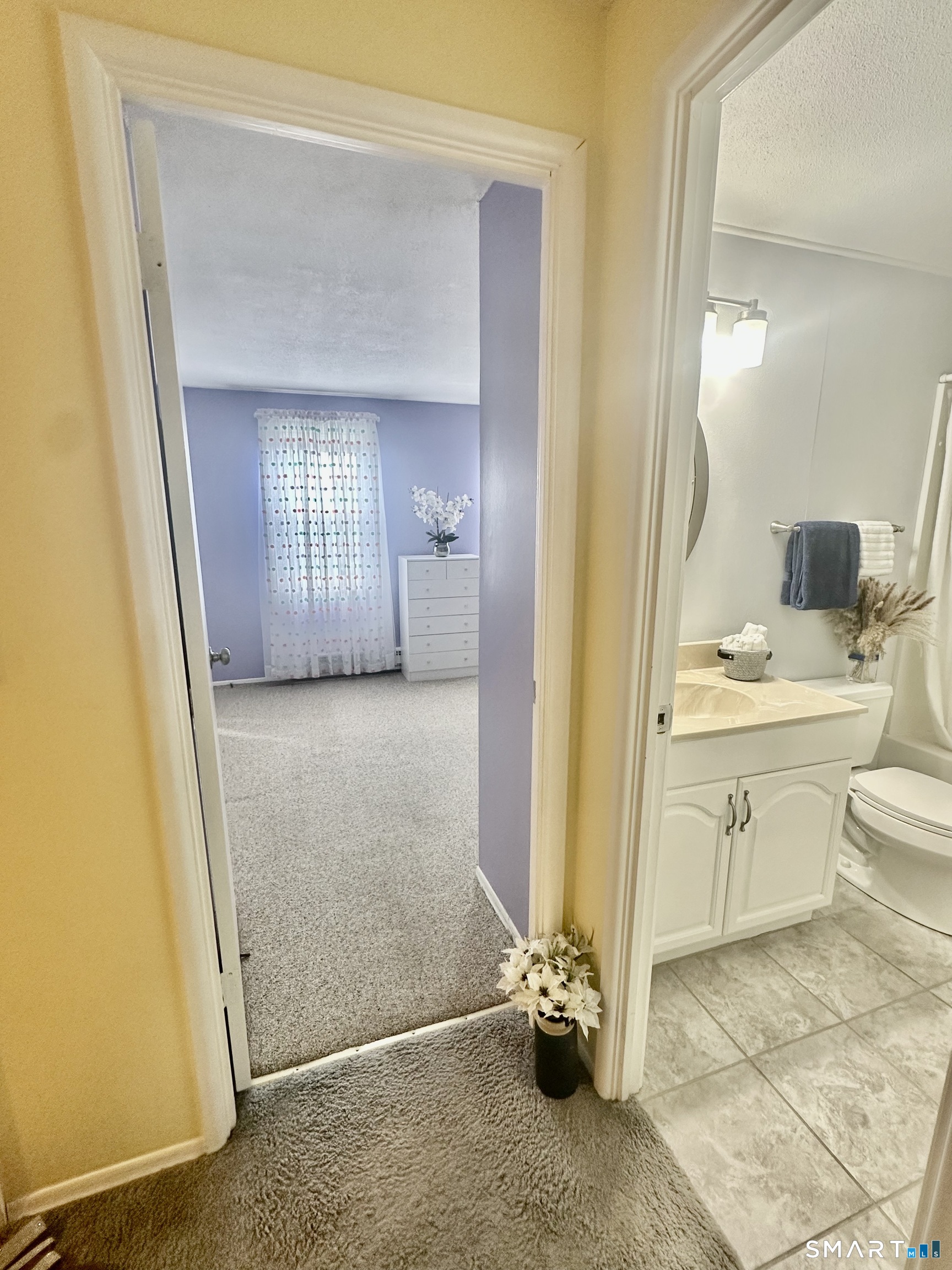 2 Lakeside Drive, Unit M Ledyard, CT 06339 - Photo 24 of 38 a bathroom with a granite countertop sink and a mirror