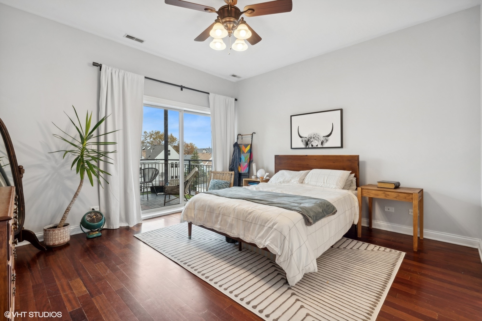 2841 North Pulaski Road, Unit 2S Chicago, IL 60641 - Photo 7 of 15 a bedroom with a large bed and a large window