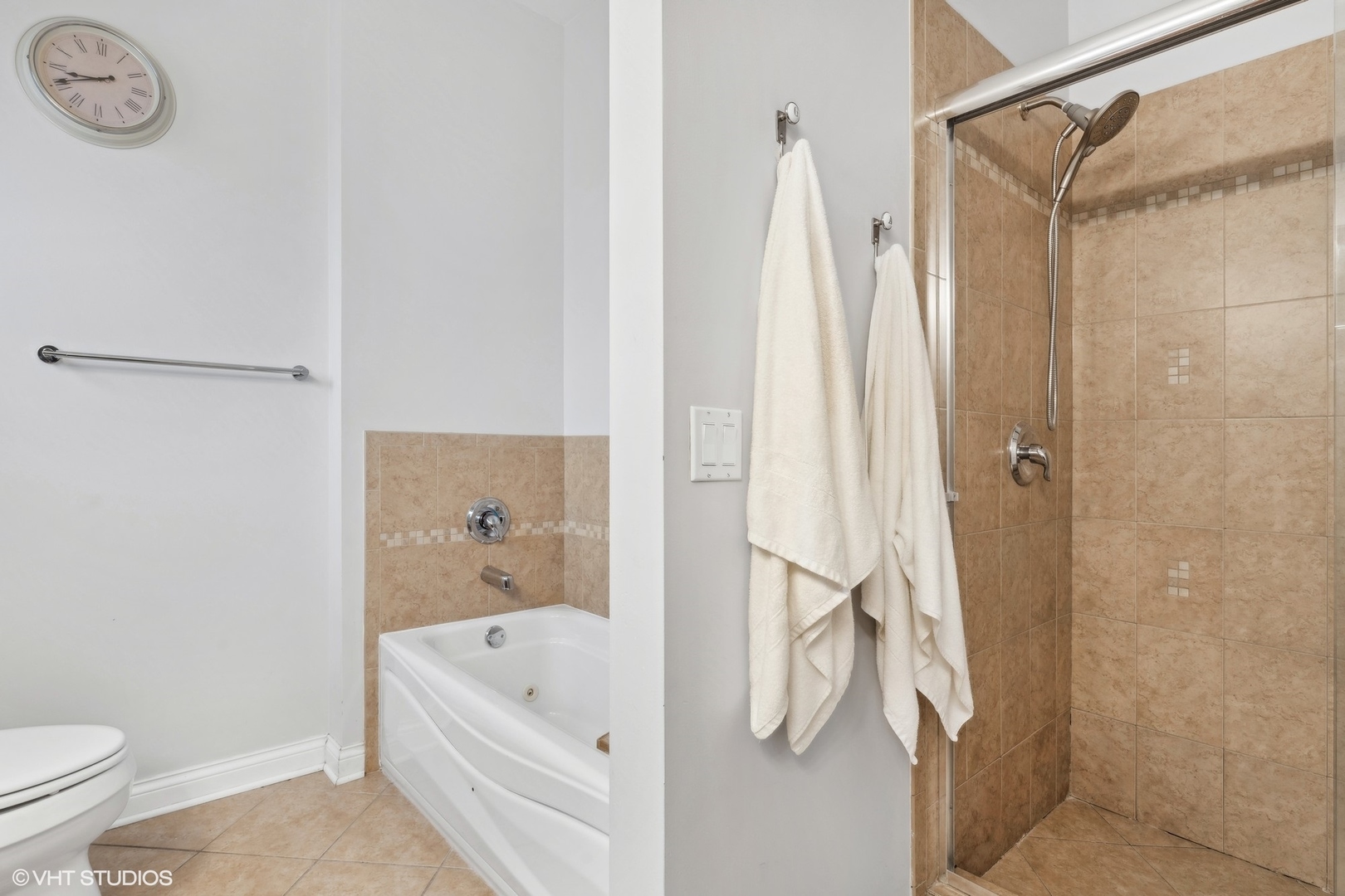 2841 North Pulaski Road, Unit 2S Chicago, IL 60641 - Photo 10 of 15 a bathroom with a tub a toilet and a shower