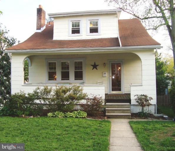 715 Murdock Road Baltimore, MD 21212 - Photo 1 of 17 a front view of a house with a garden