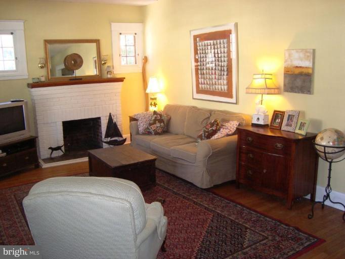 715 Murdock Road Baltimore, MD 21212 - Photo 3 of 17 a living room with furniture and a fireplace