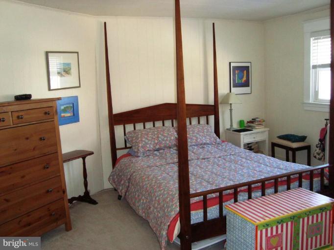 715 Murdock Road Baltimore, MD 21212 - Photo 6 of 17 a bedroom with a bed window and a dresser in it