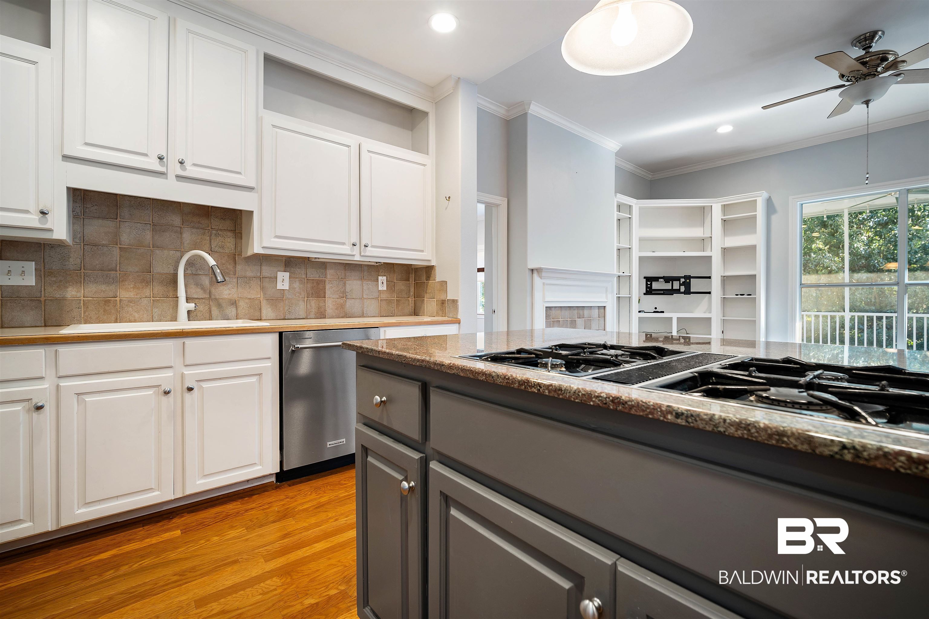 204 General Canby Loop Daphne, AL 36527 - Photo 11 of 36 Kitchen featuring ceiling fan, light hardwood / wood-style flooring, sink, stainless steel appliances, and white cabinets