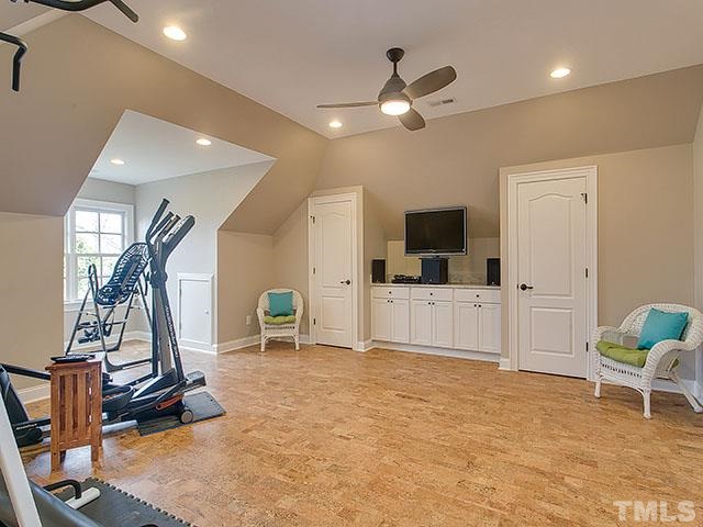 3052 Farrior Road Raleigh, NC 27607 - Photo 22 of 25 The third floor is not to be missed! The main oversized room is currently used as a workout room. There is a wet bar and full bath allowing for flexible usage. A bonus room, craft room, storage and cork floors finish out this floor!