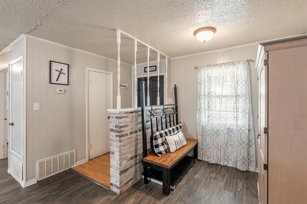 508 West 9th Street Kemp, TX 75143 - Photo 25 of 32 a view of an empty room with wooden floor and a window