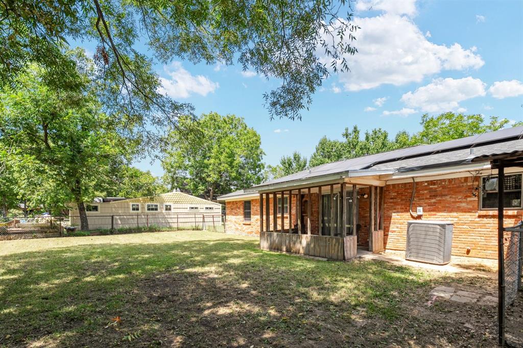 508 West 9th Street Kemp, TX 75143 - Photo 32 of 32 a view of a house with backyard and a tree