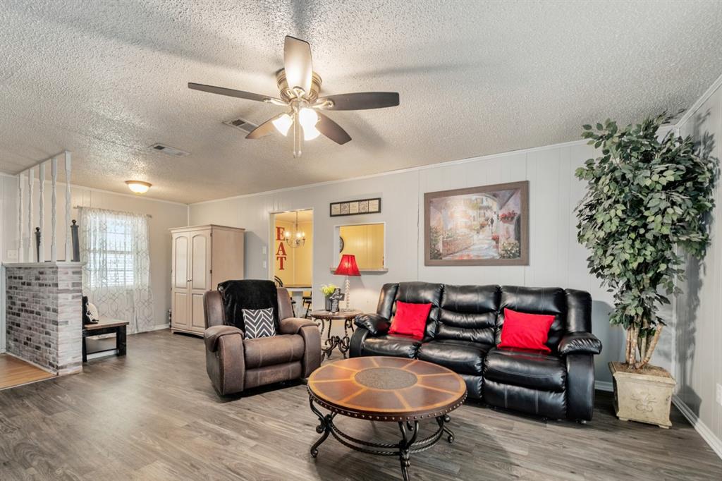 508 West 9th Street Kemp, TX 75143 - Photo 6 of 32 a living room with furniture and a fireplace