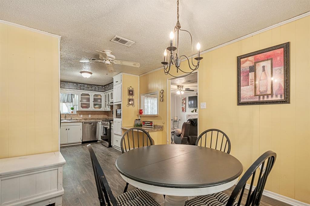 508 West 9th Street Kemp, TX 75143 - Photo 9 of 32 a view of a dining room with furniture window and wooden floor