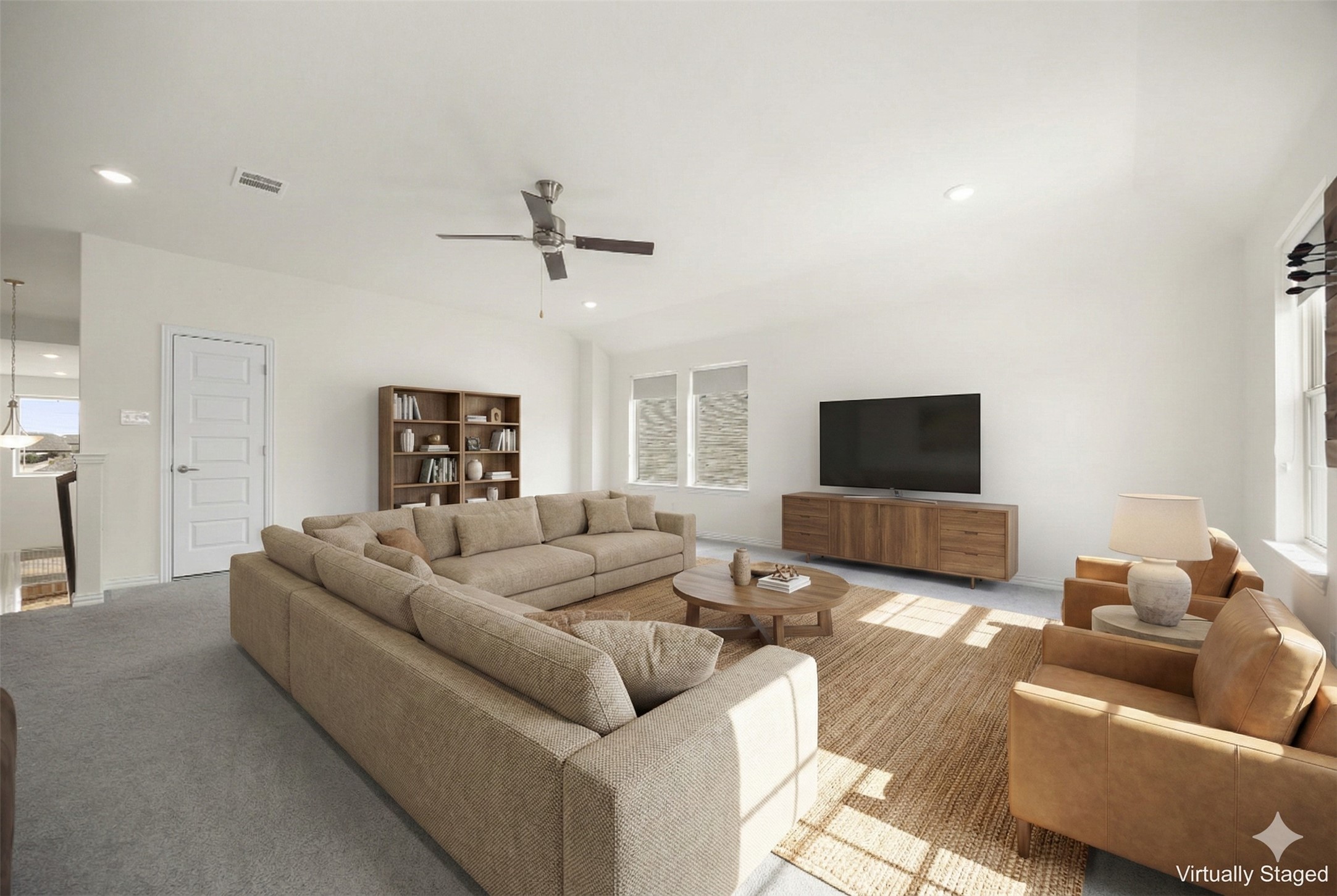 1098 Cherrystone Loop Buda, TX 78610 - Photo 23 of 37 a living room with furniture and a flat screen tv
