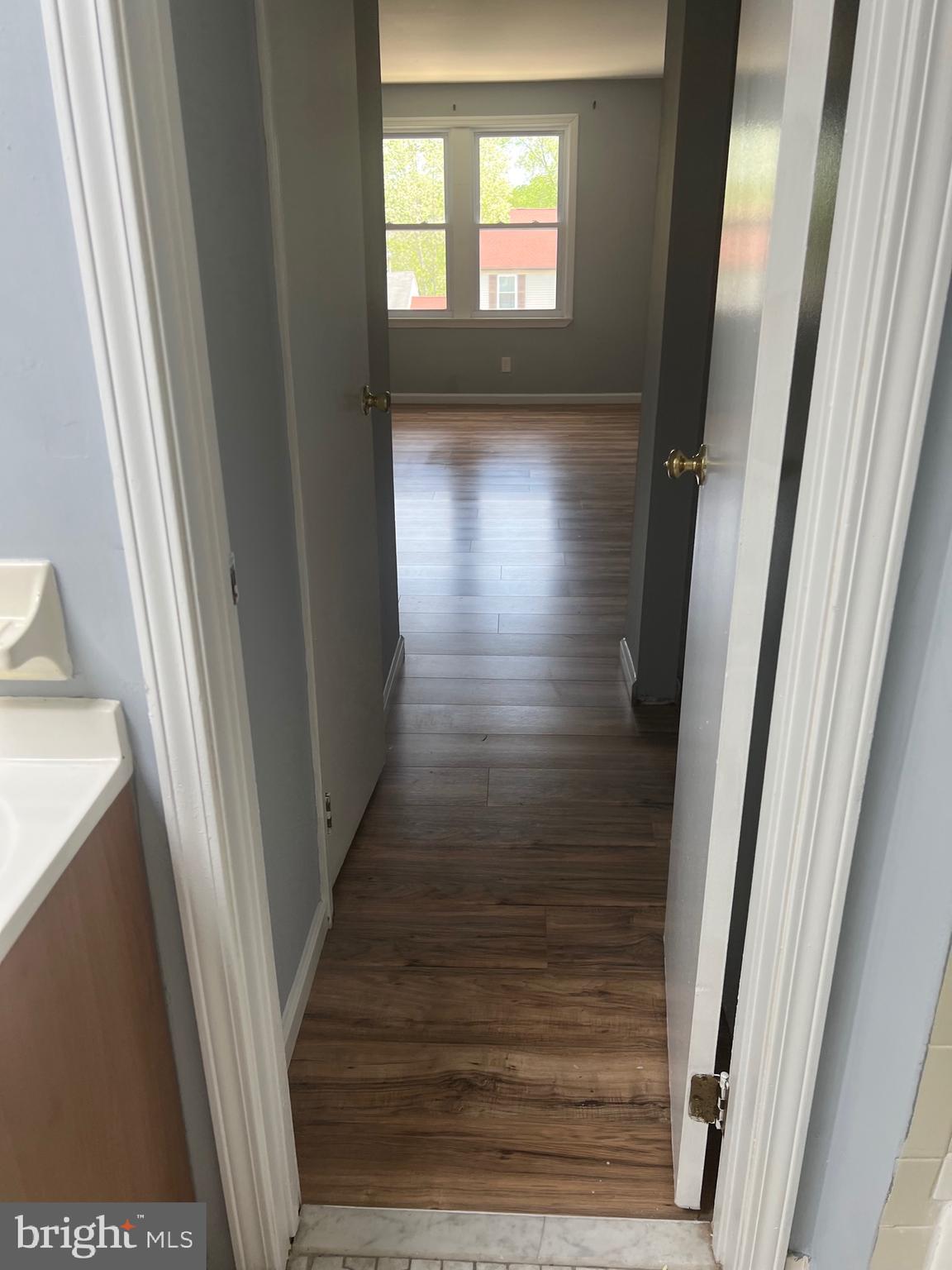 13 A Hampton Gate Drive Sicklerville, NJ 08081 - Photo 17 of 23 a view of hallway with wooden floor