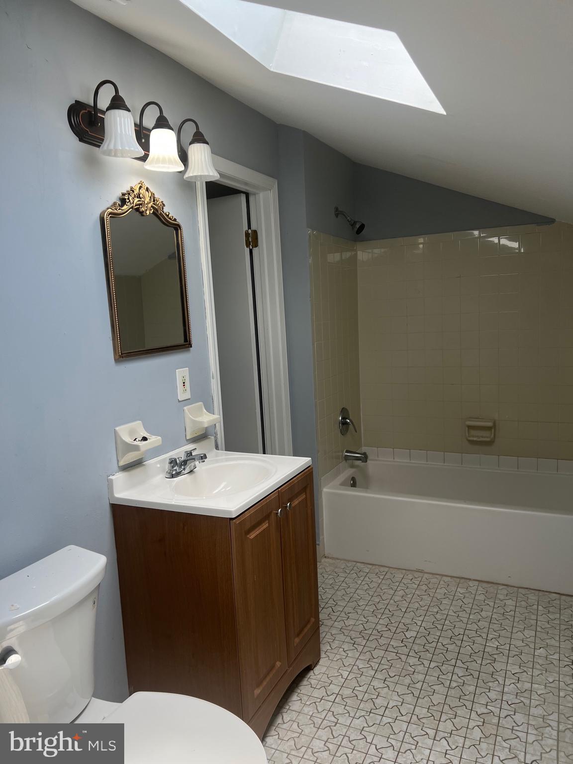 13 A Hampton Gate Drive Sicklerville, NJ 08081 - Photo 23 of 23 a bathroom with a toilet a sink and bathtub