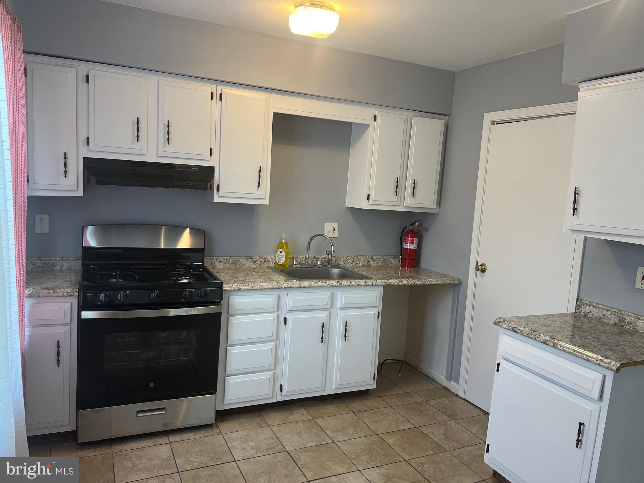 13 A Hampton Gate Drive Sicklerville, NJ 08081 - Photo 6 of 23 a kitchen with granite countertop white cabinets and stainless steel appliances