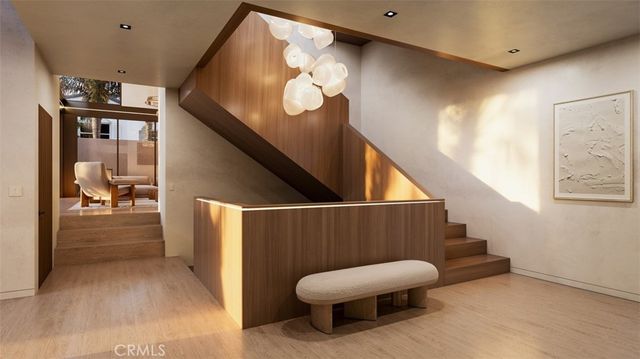 a living room with couches tv and a fireplace