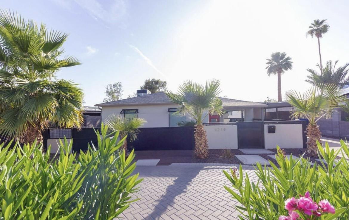 4214 North 20th Street Phoenix, AZ 85016 - Photo 1 of 40 a front view of a house with a yard and potted plants