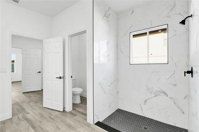 a bathroom with a bathtub and a toilet