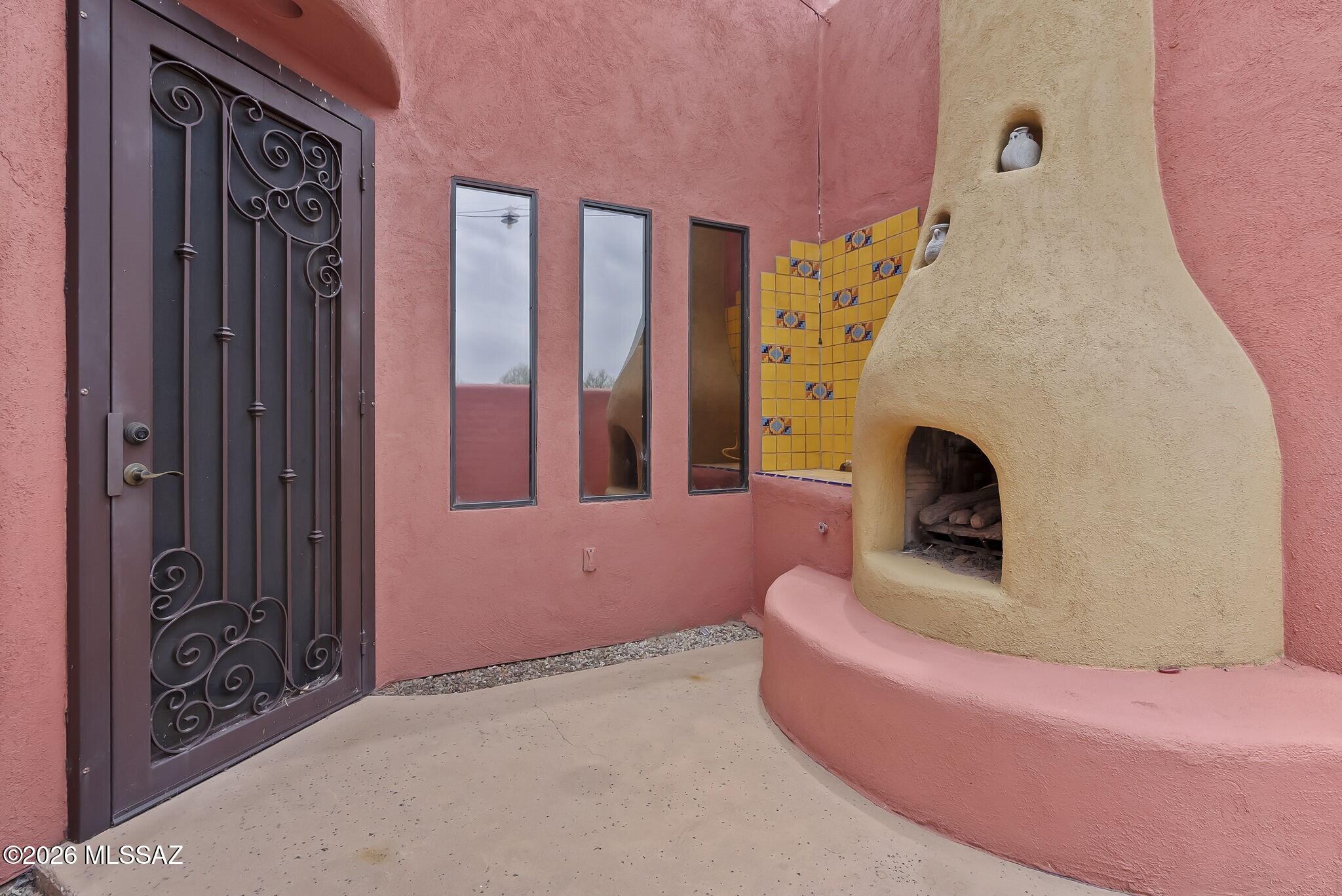 101 Post Way Tubac, AZ 85646 - Photo 3 of 31 a living room with furniture and a fireplace
