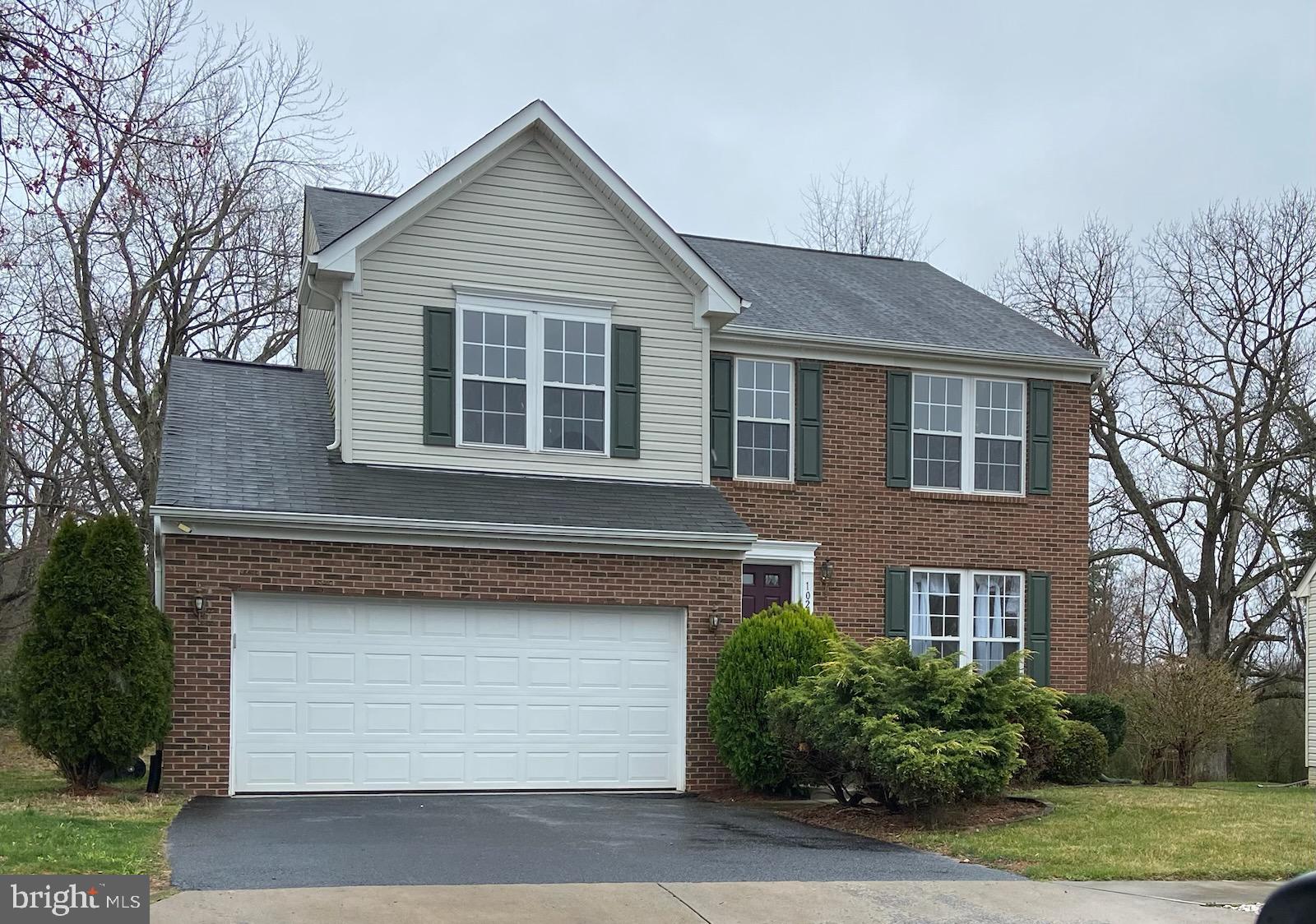 1028 Riverdale Circle Culpeper, VA 22701 - Photo 1 of 32 a front view of a house with a yard and garage