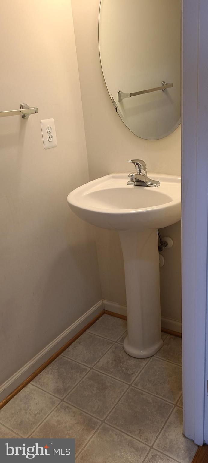 1028 Riverdale Circle Culpeper, VA 22701 - Photo 17 of 32 a bathroom with a sink and vanity