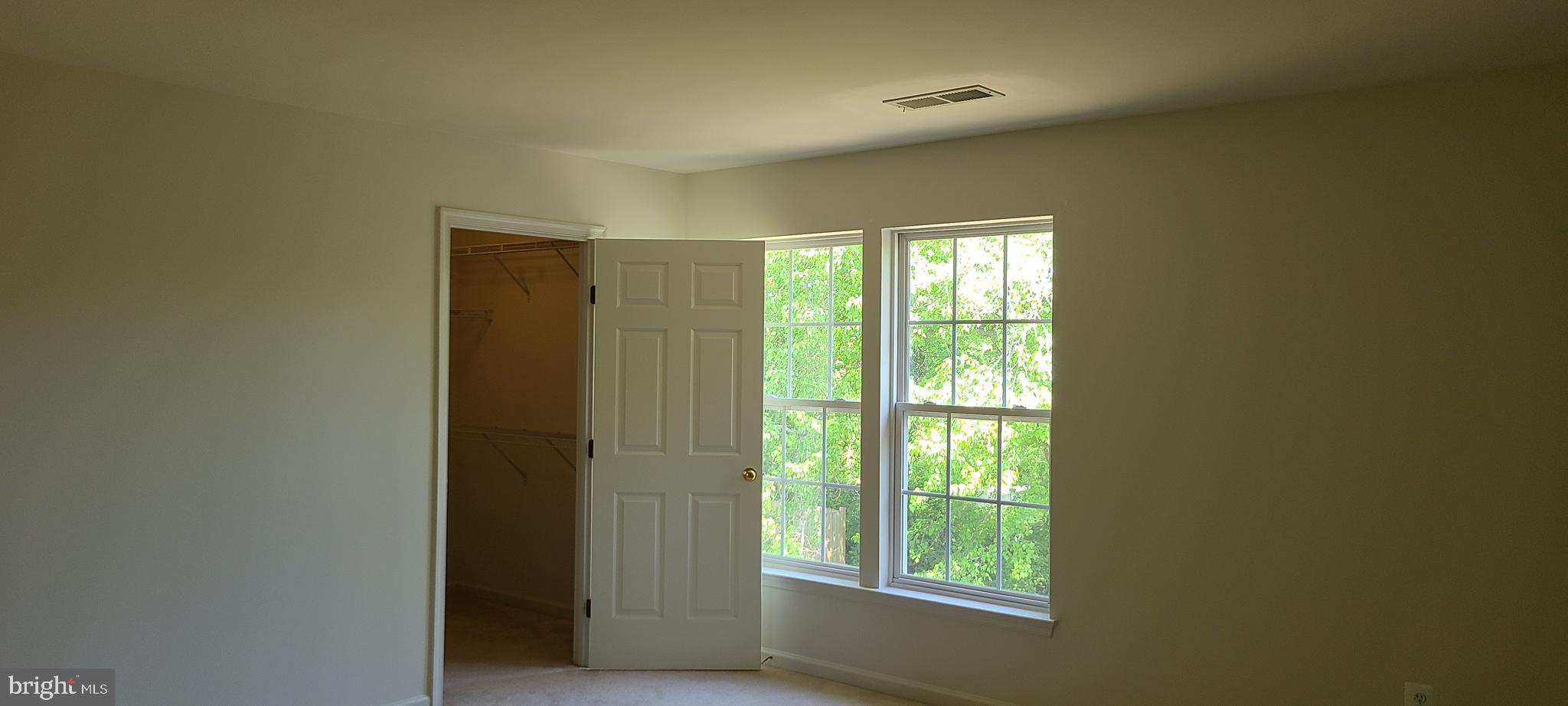 1028 Riverdale Circle Culpeper, VA 22701 - Photo 18 of 32 a view of an empty room with a window