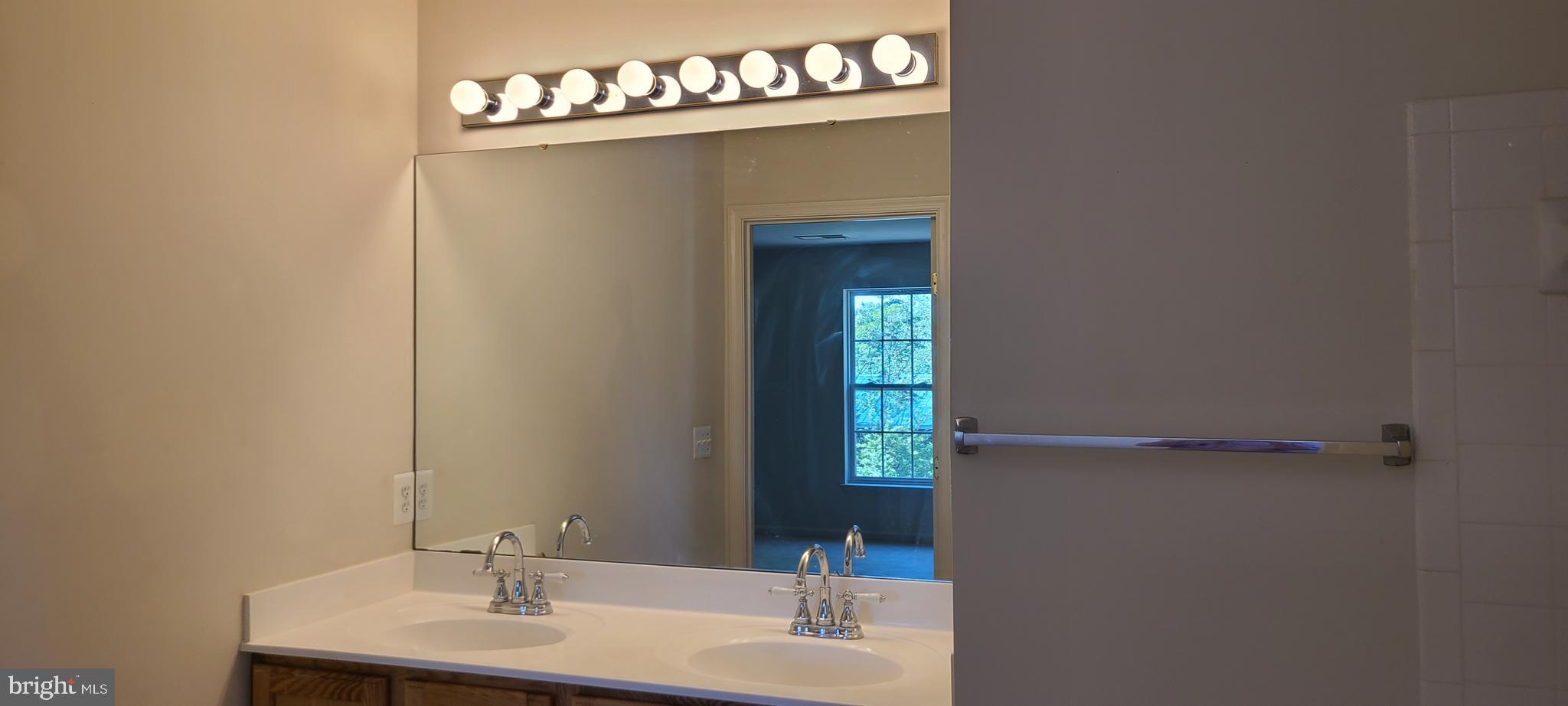 1028 Riverdale Circle Culpeper, VA 22701 - Photo 25 of 32 a bathroom with a sink and a mirror