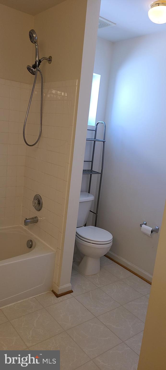 1028 Riverdale Circle Culpeper, VA 22701 - Photo 26 of 32 a bathroom with a toilet and a shower