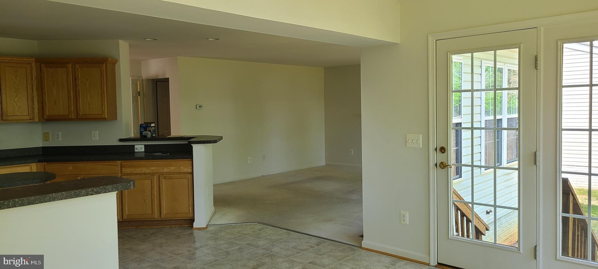 1028 Riverdale Circle Culpeper, VA 22701 - Photo 7 of 32 a kitchen with granite countertop a sink and a refrigerator
