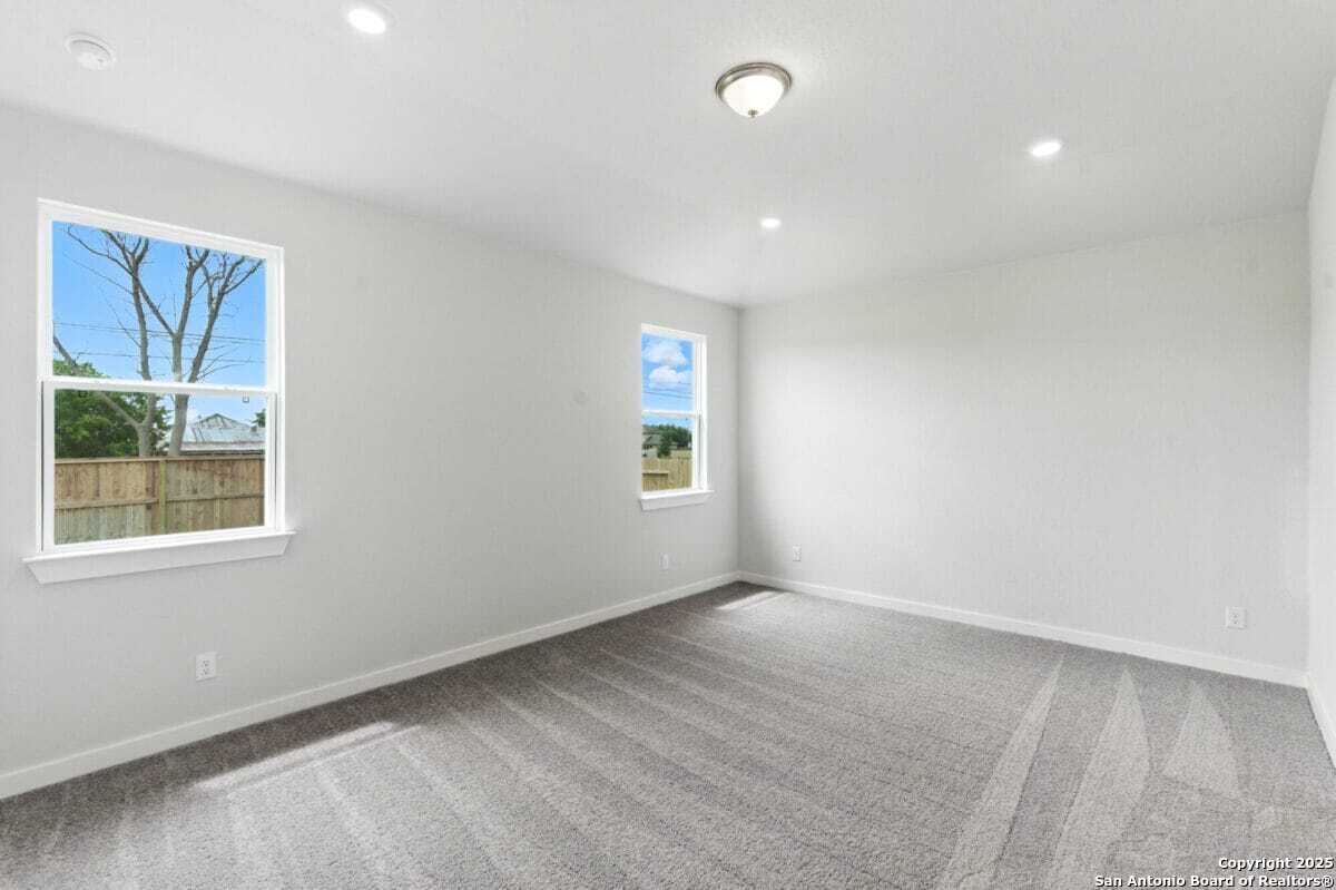 1896 Split Rock Road New Braunfels, TX 78130 - Photo 11 of 22 an empty room with a window