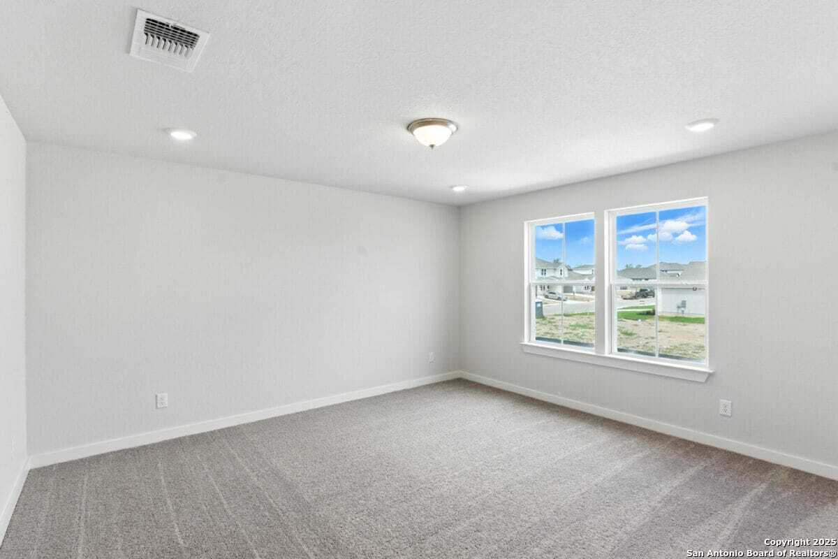 1896 Split Rock Road New Braunfels, TX 78130 - Photo 16 of 22 an empty room with windows