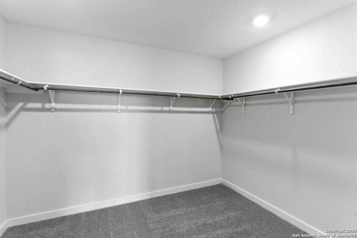 1896 Split Rock Road New Braunfels, TX 78130 - Photo 18 of 22 a view of a room with shelf on the wall