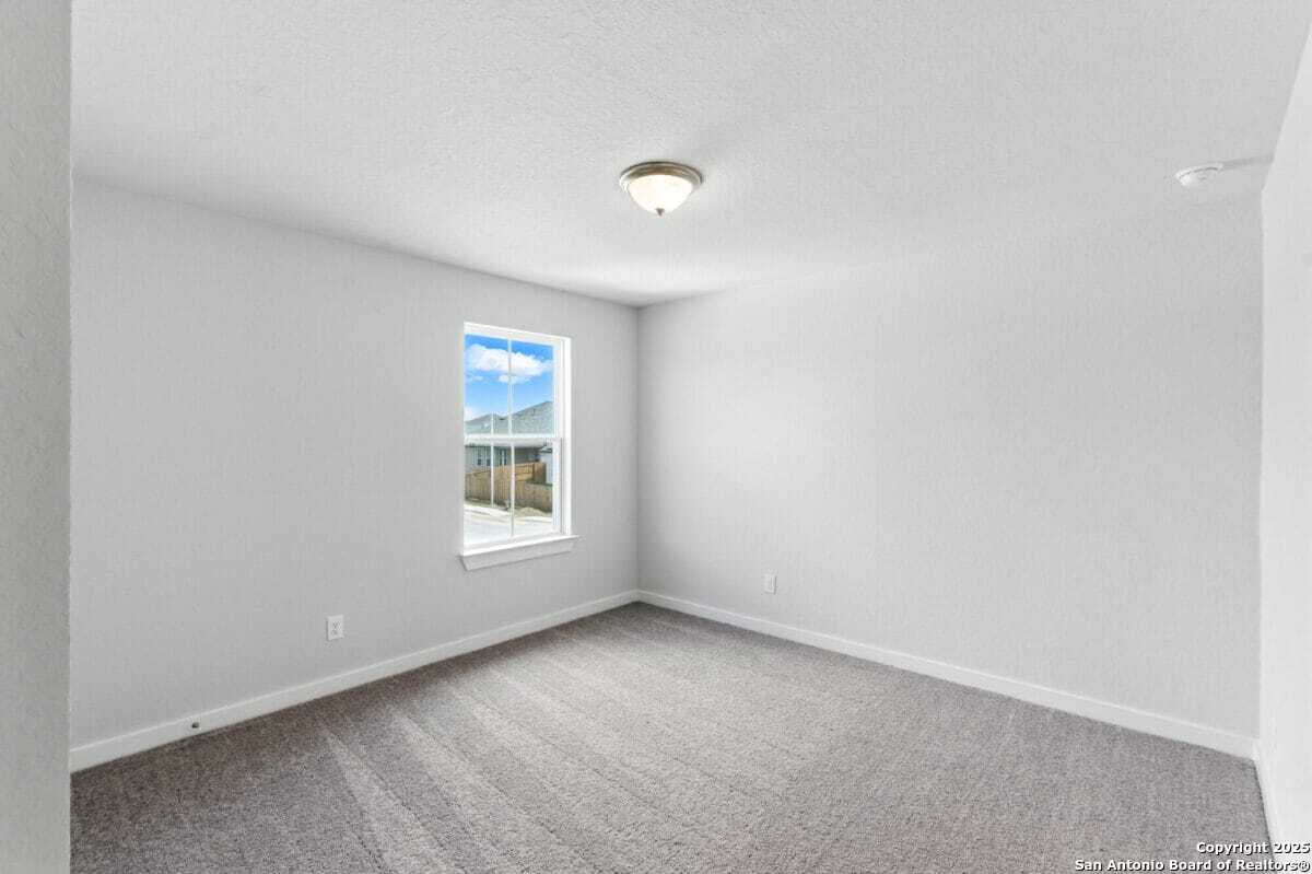 1896 Split Rock Road New Braunfels, TX 78130 - Photo 19 of 22 a view of an empty room with a window