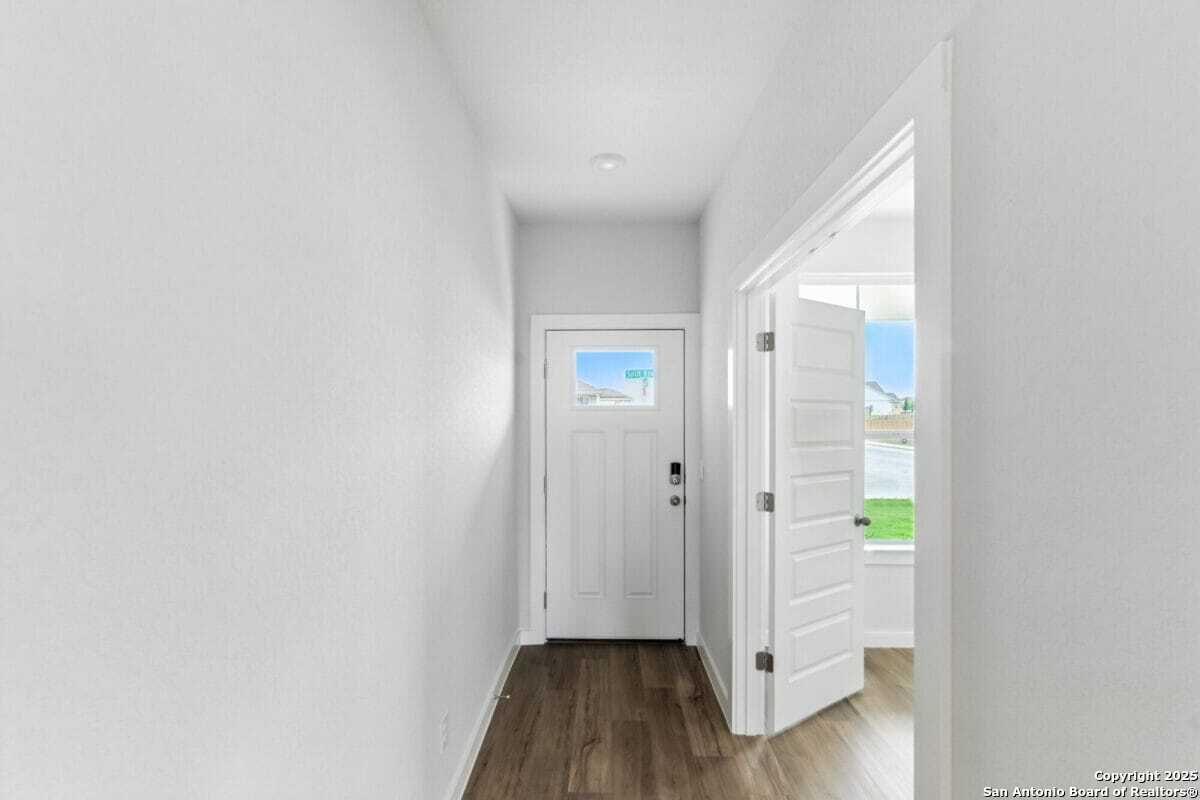 1896 Split Rock Road New Braunfels, TX 78130 - Photo 20 of 22 a view of front door with wooden floor